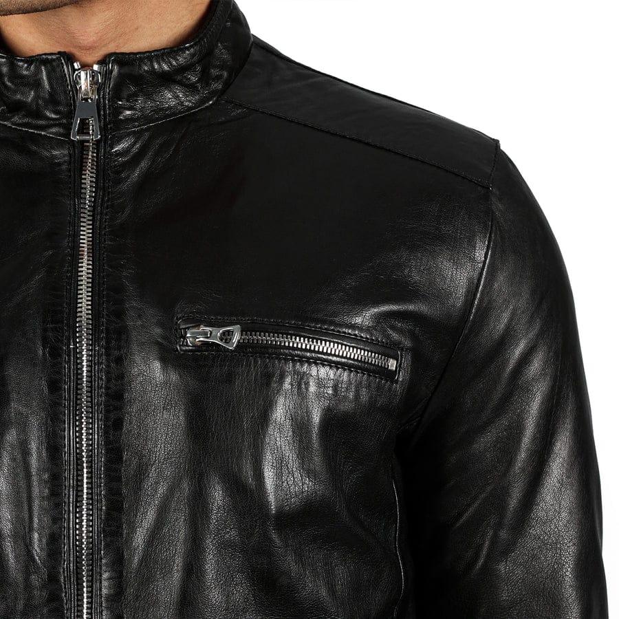 Close-up of the snap band collar on a black leather café racer jacket